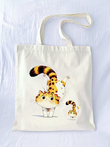 Soft and lightweight sustainable cotton shoulder bag featuring a cute cat print