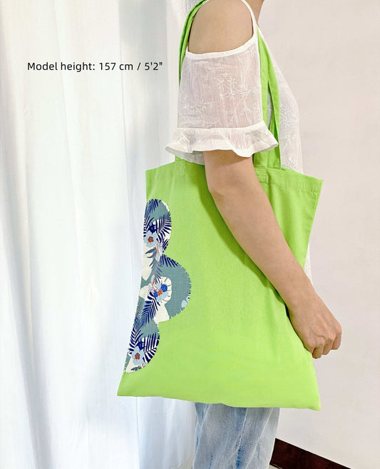 Durable fabric shoulder bag featuring artisanal patchwork details