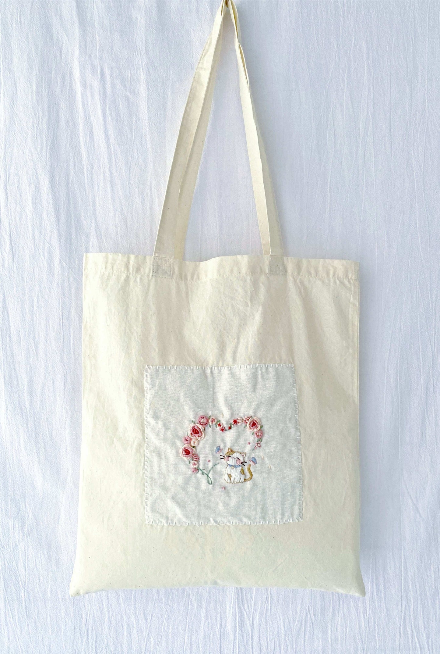 holiday gift tote with delicate hand embroidered embroidery