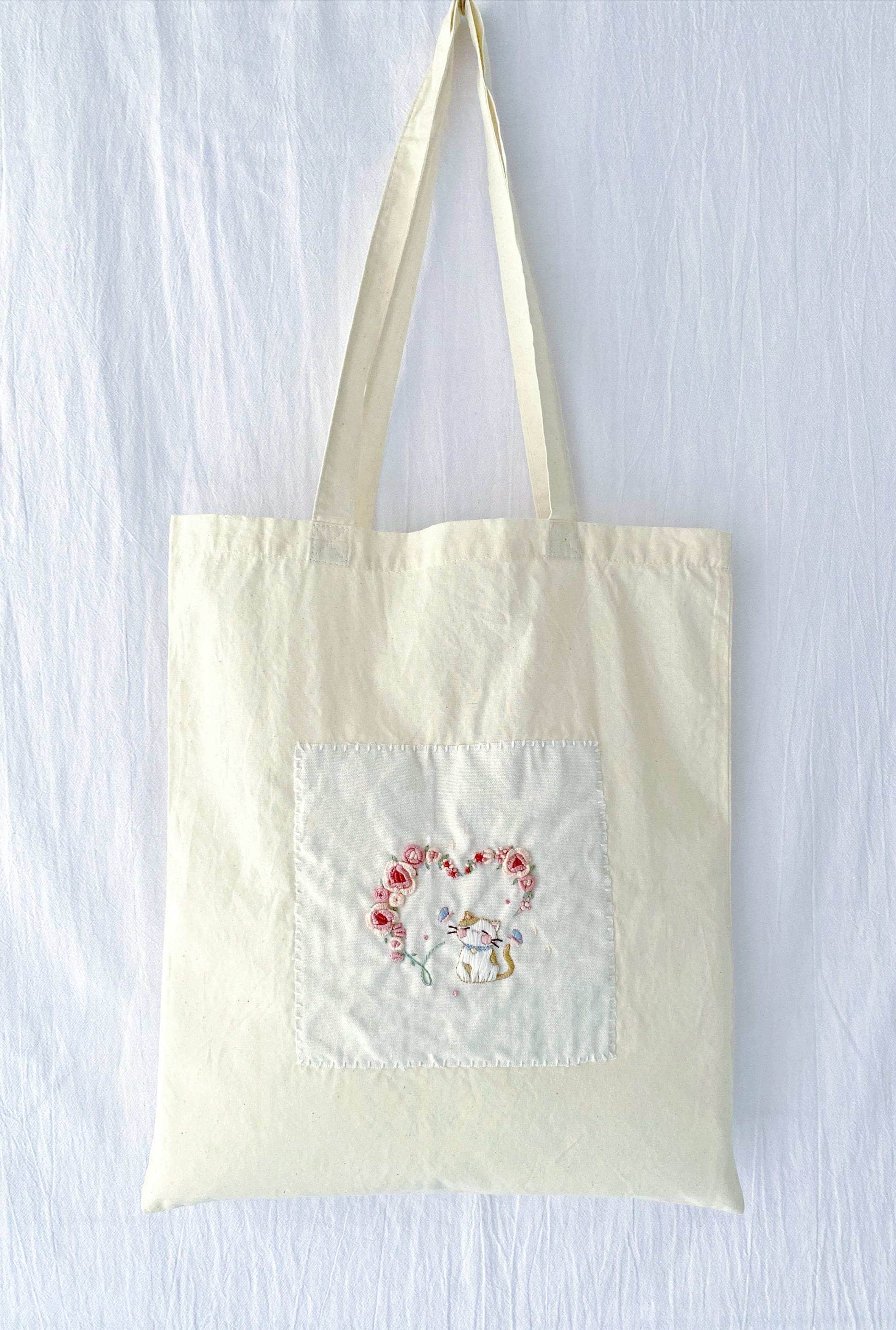 holiday gift tote with delicate hand embroidered embroidery