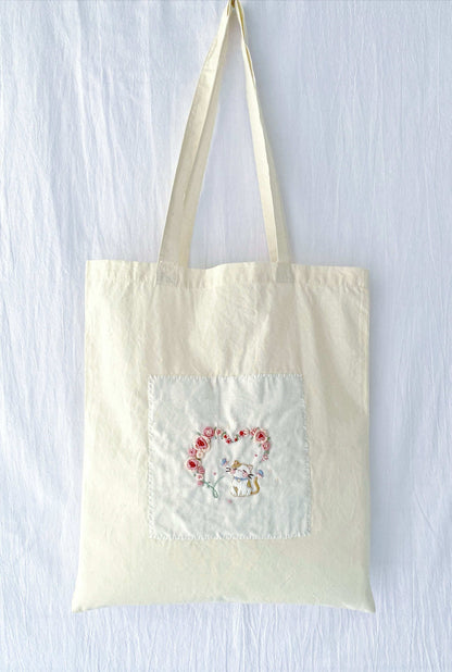 holiday gift tote with delicate hand embroidered embroidery