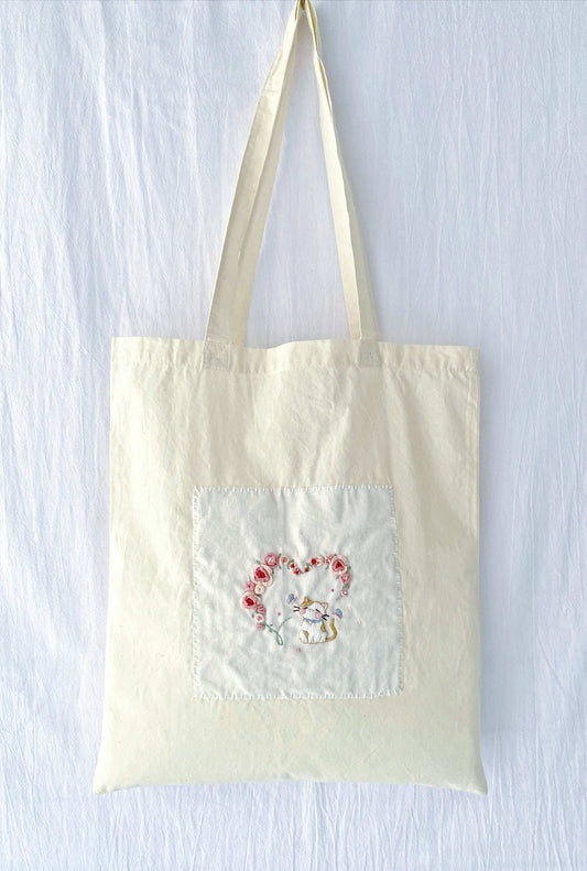 holiday gift tote with delicate hand embroidered embroidery