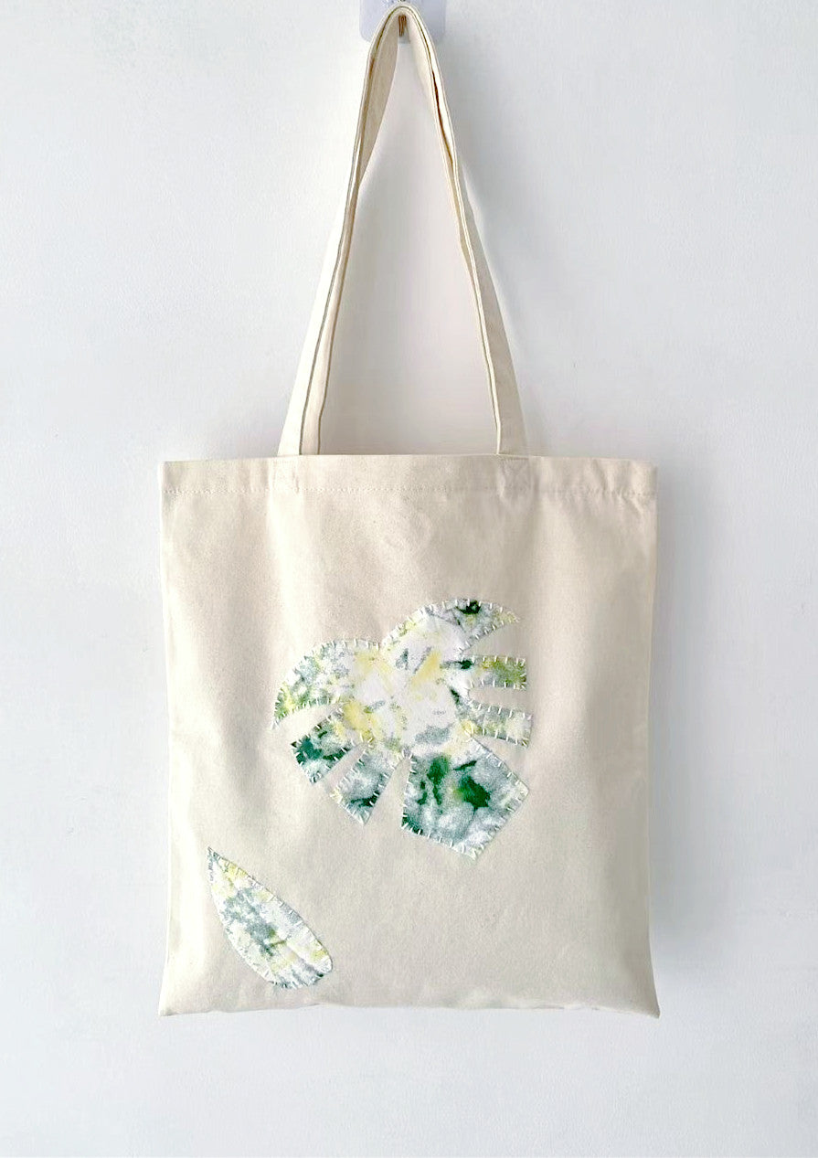 Simple design cotton tote bag highlighting hand-stitched patterns