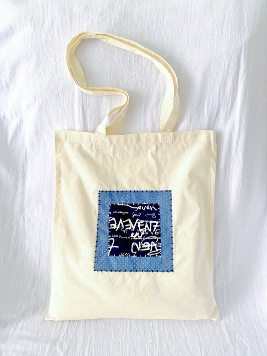 Bolso de mano con parche cosido a mano