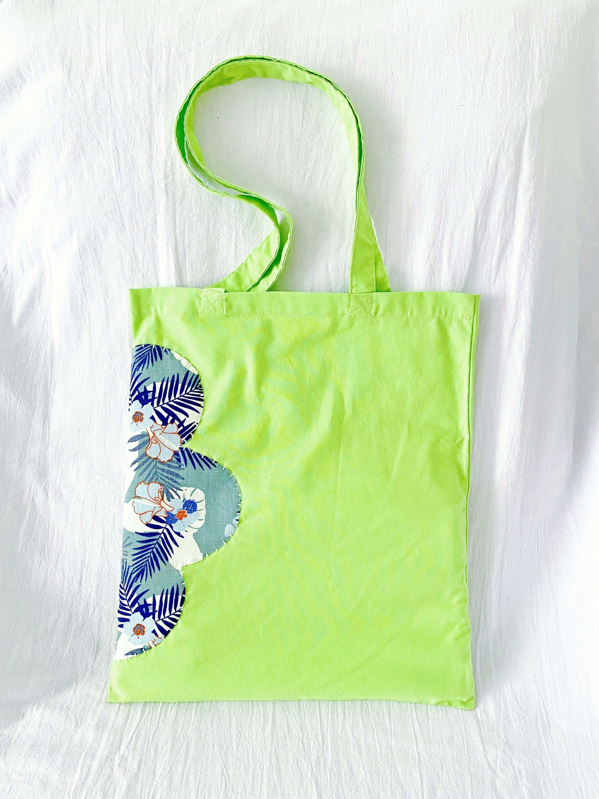 Soft cotton shoulder bag blending creativity and sustainability through sewn patchwork motifs