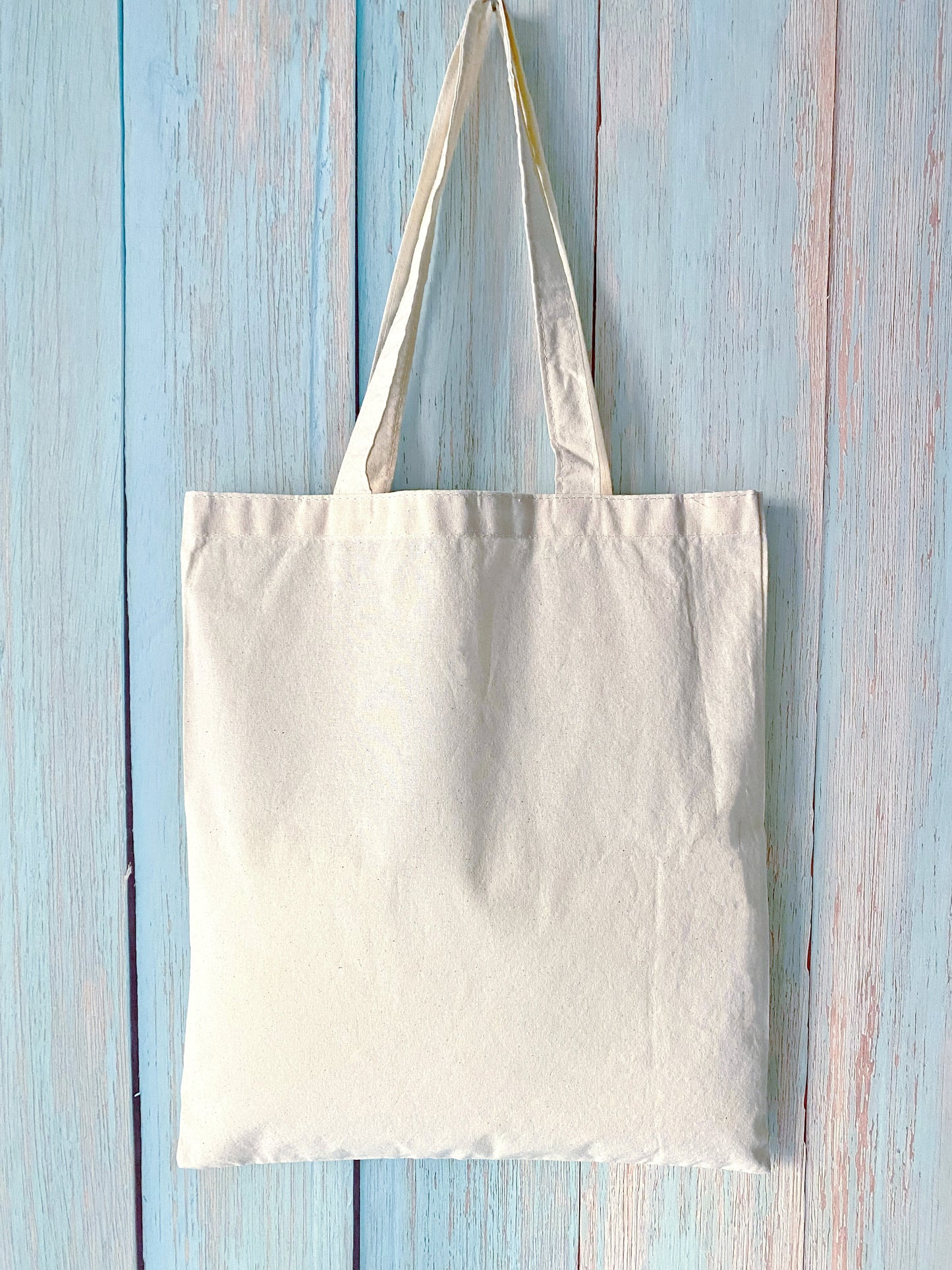 A soft, spacious cotton tote with an inspiring English short phrase, combining eco-consciousness and daily utility.