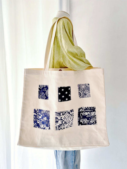 Minimalist canvas tote for women, crafted from natural fibers with hand-stitched patchwork for a touch of artistic flair