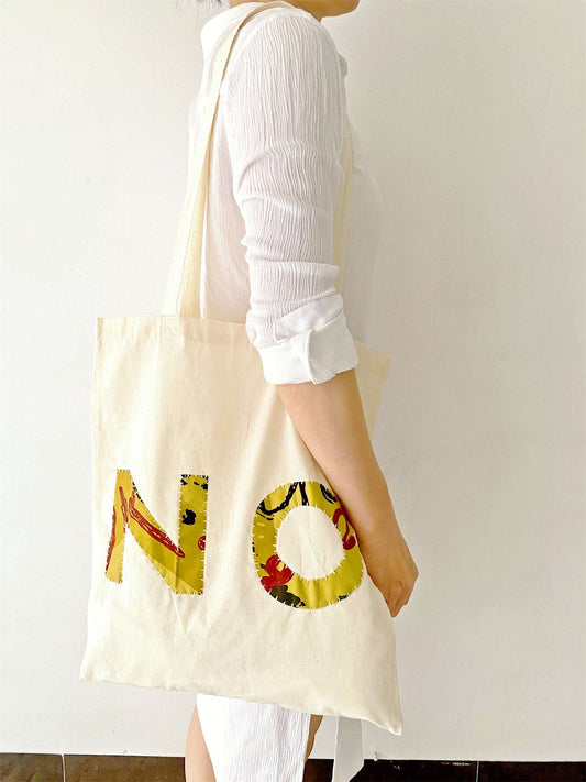 boho-style cotton tote with stitched detail