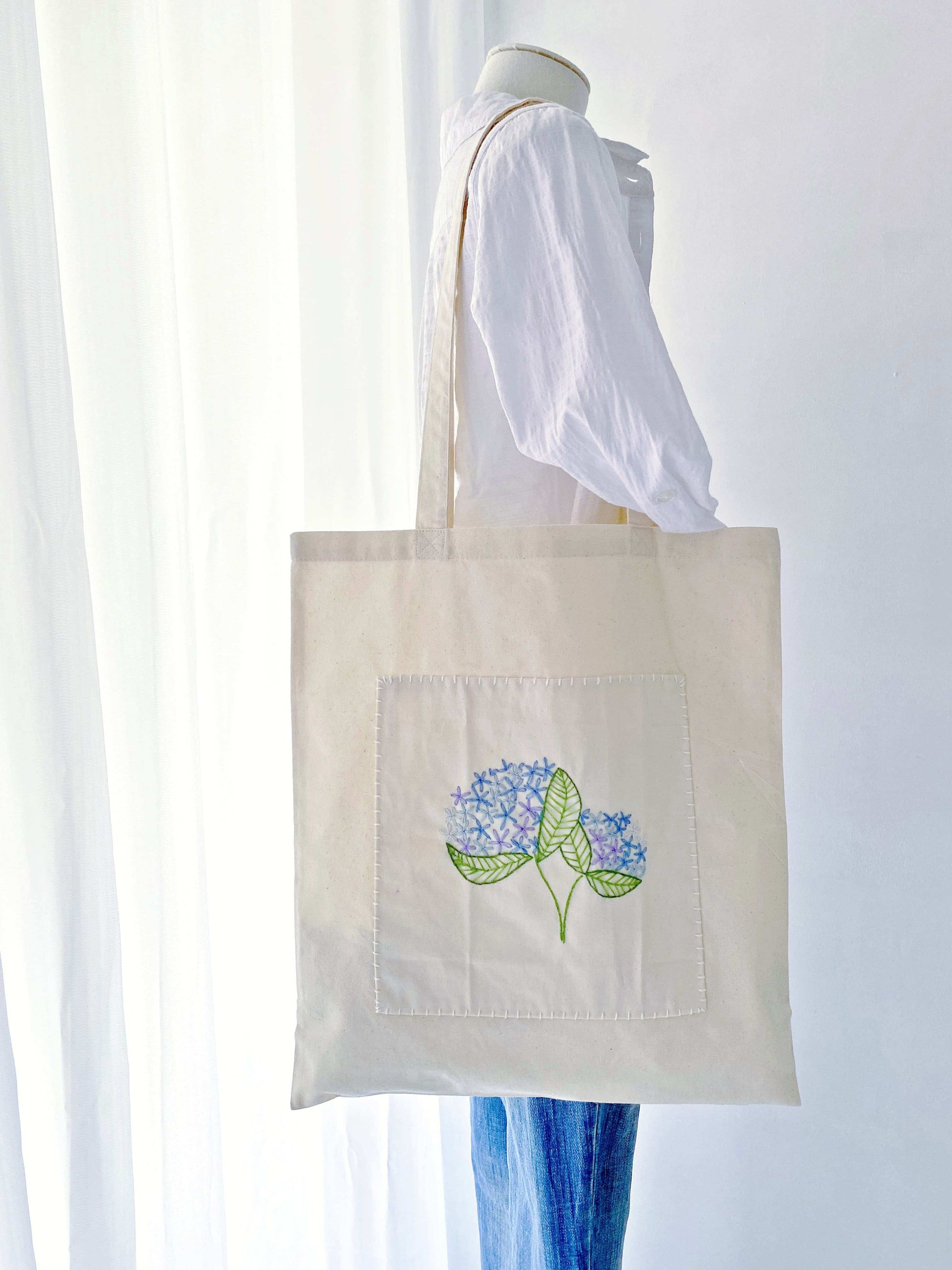 lightweight spacious tote bag with hand embroidered details