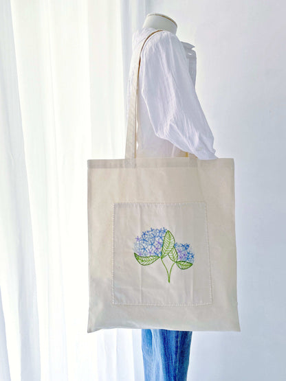 lightweight spacious tote bag with hand embroidered details