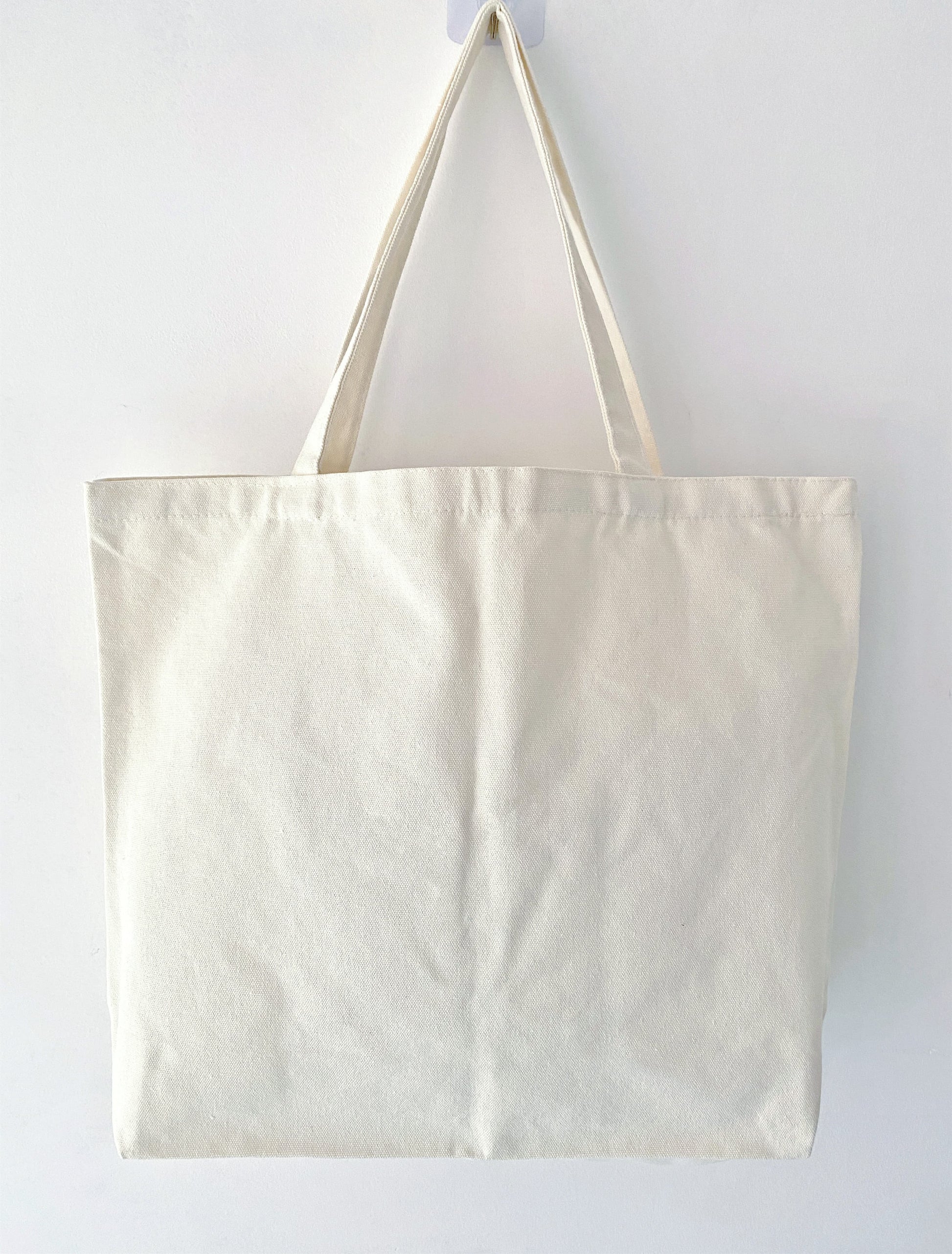 Sustainable fashion tote with natural cotton fabric and patchwork detail