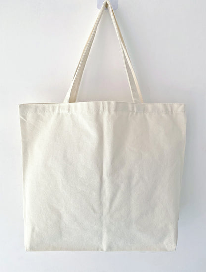 Sustainable fashion tote with natural cotton fabric and patchwork detail