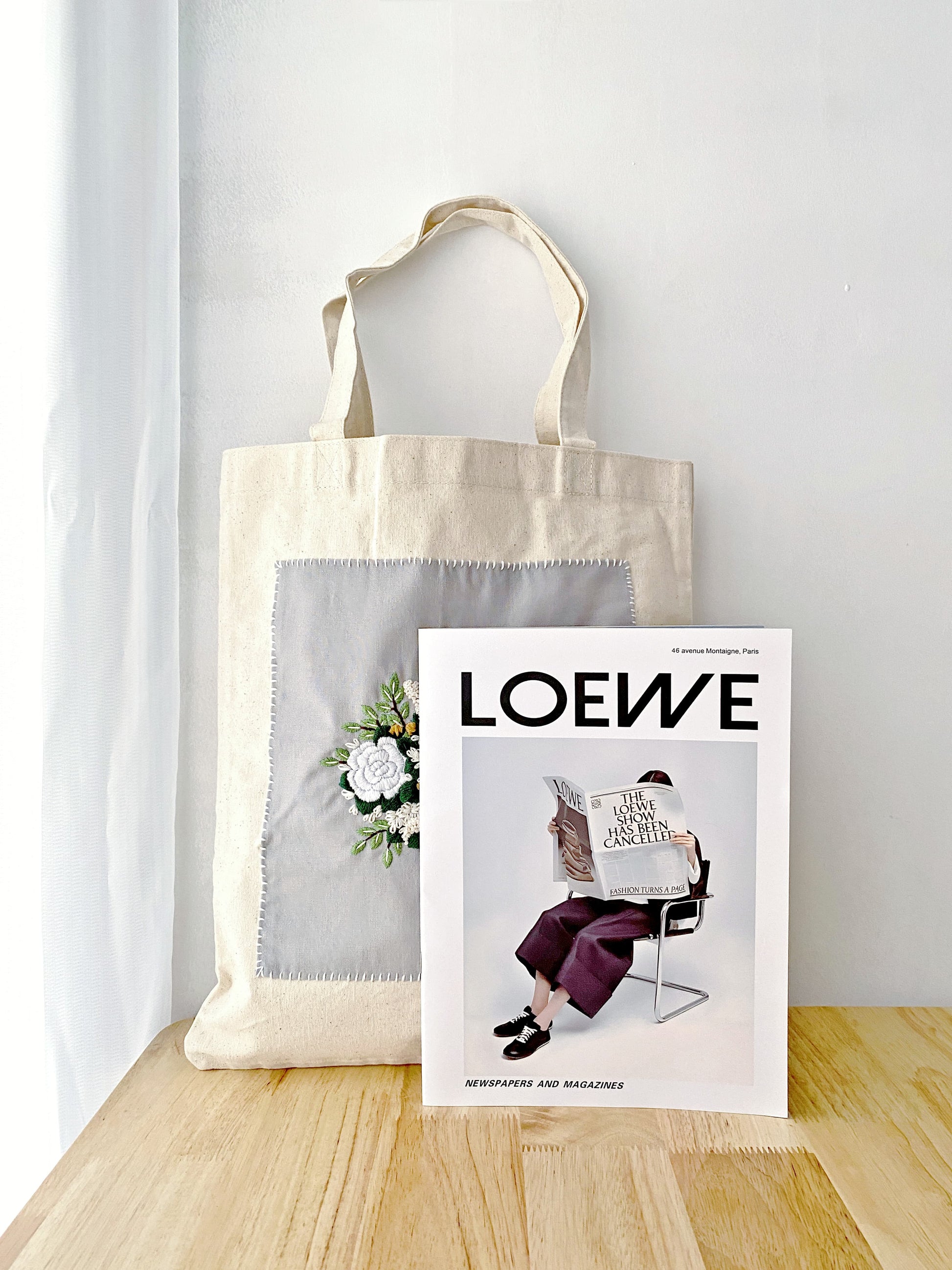 Creative women’s canvas tote bag with hand-embroidered floral design