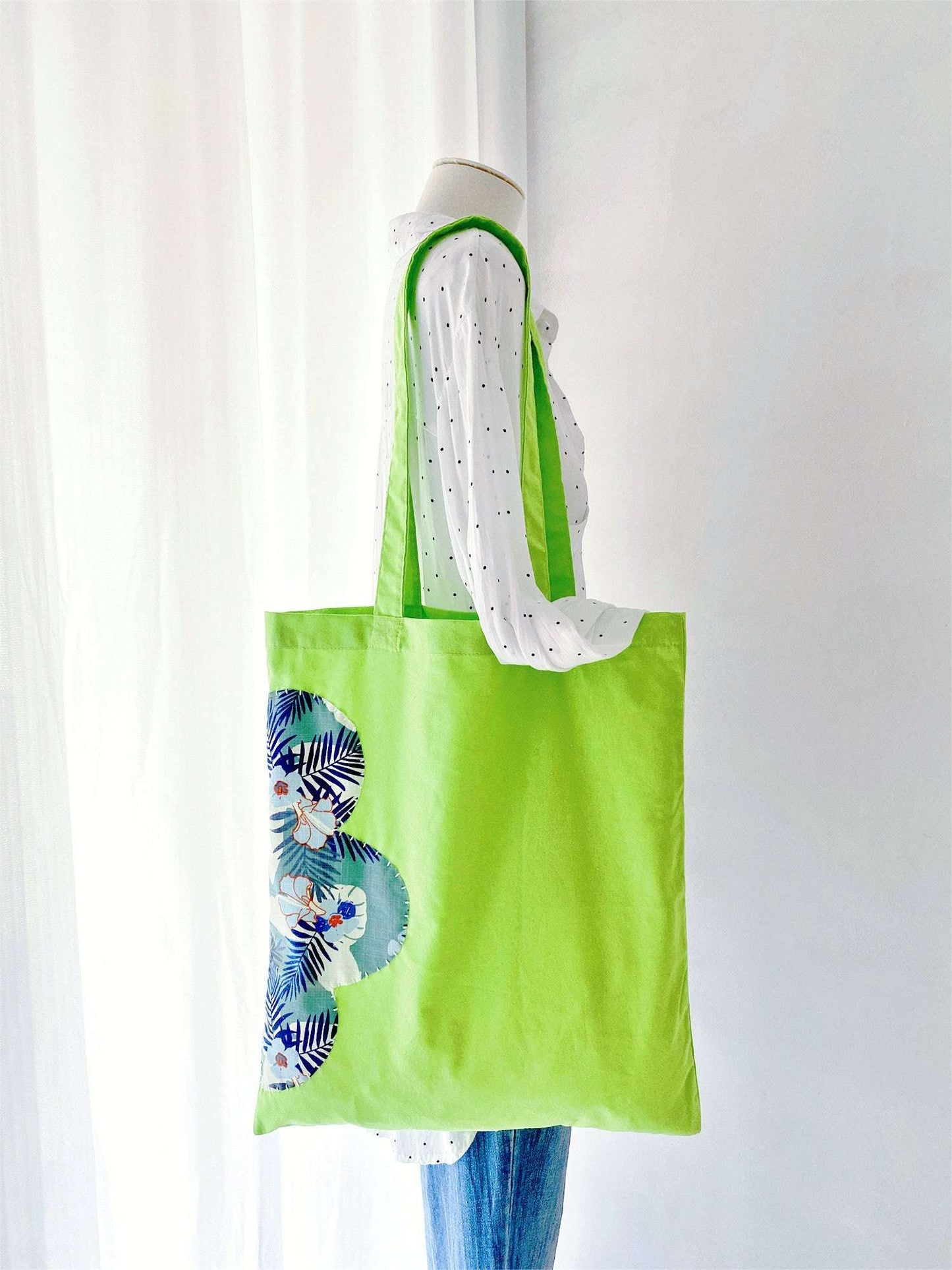 Creative cotton bag with hand-stitched designs, perfect for slow living enthusiasts on the go