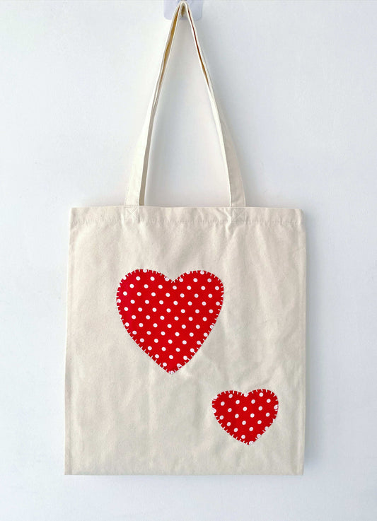 Spacious cotton canvas tote bag with hand-stitched patchwork for everyday essentials