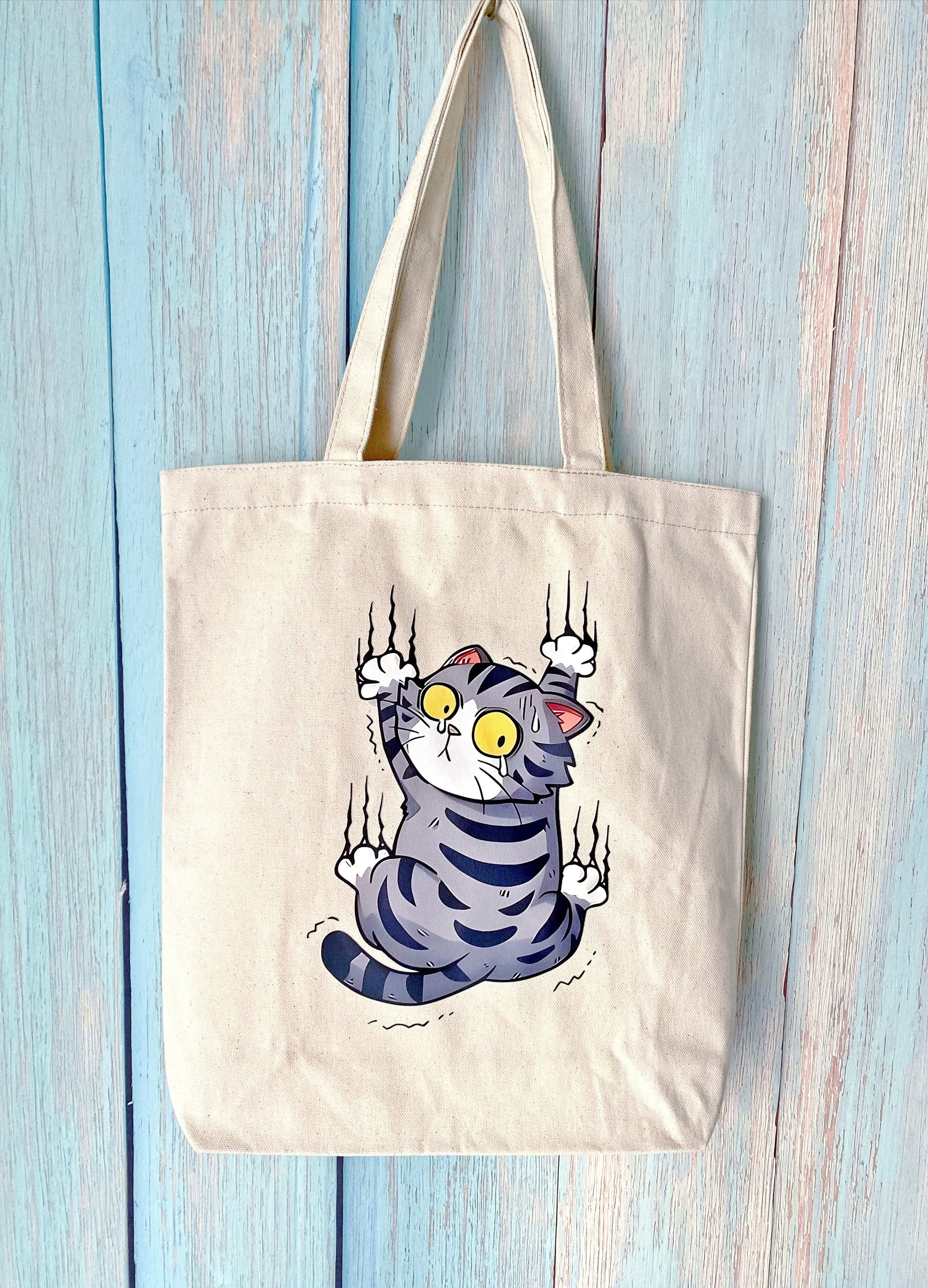 Durable cotton canvas tote with handmade cat print, ideal for conscious shoppers in Europe