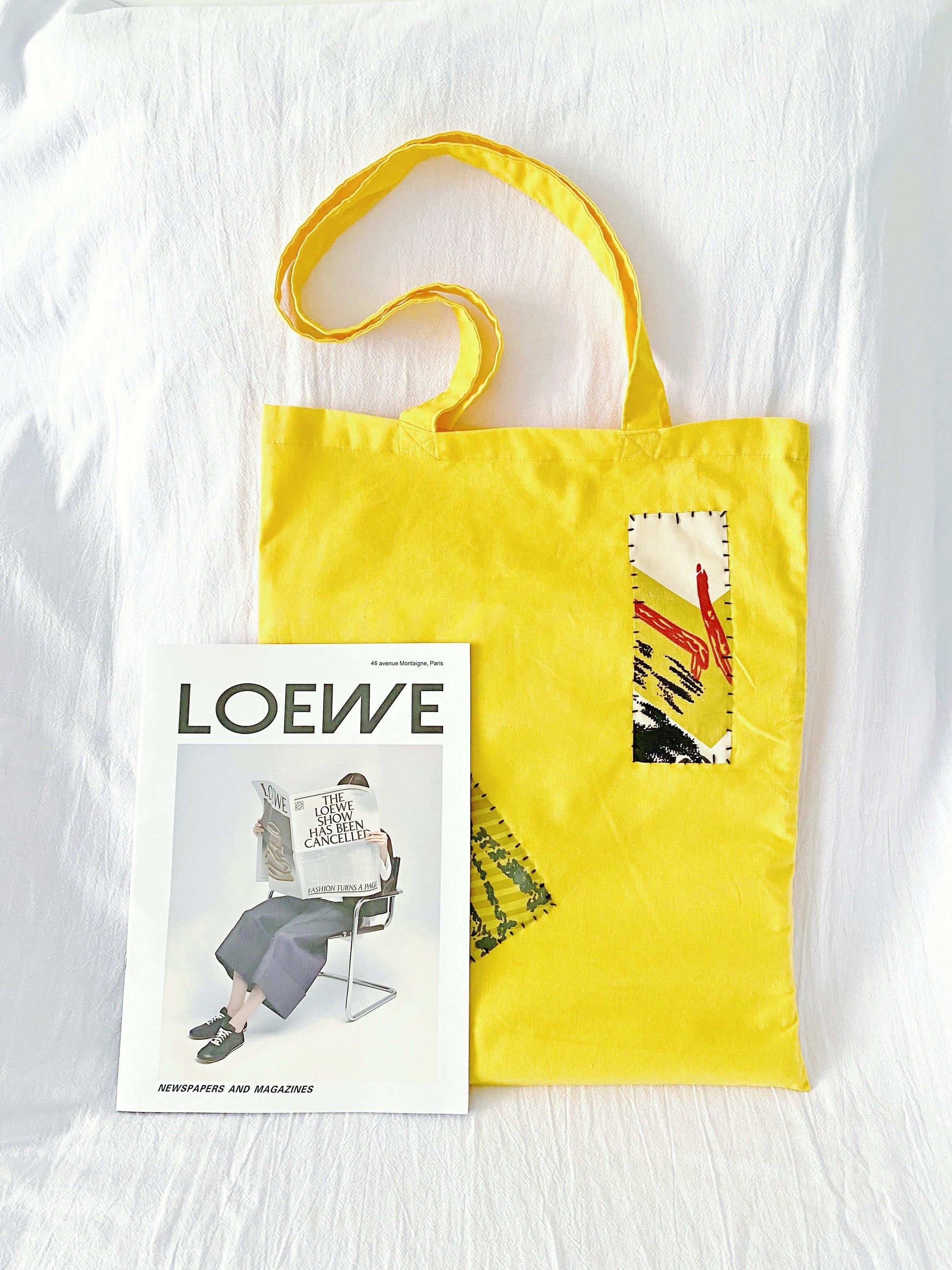 Sustainable shoulder bag showcasing hand-stitched patterns for a unique, effortless style