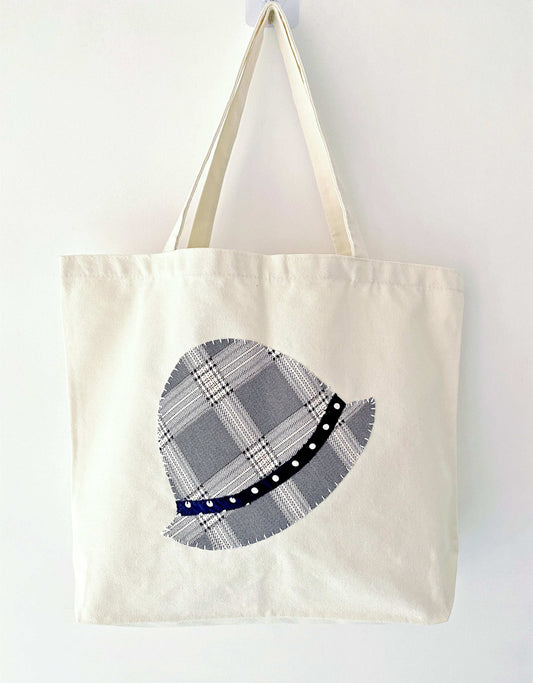 Minimalist shoulder bag made of natural cotton canvas with stitched patchwork