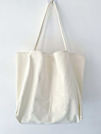 Durable patchwork-style canvas bag reflecting slow fashion values