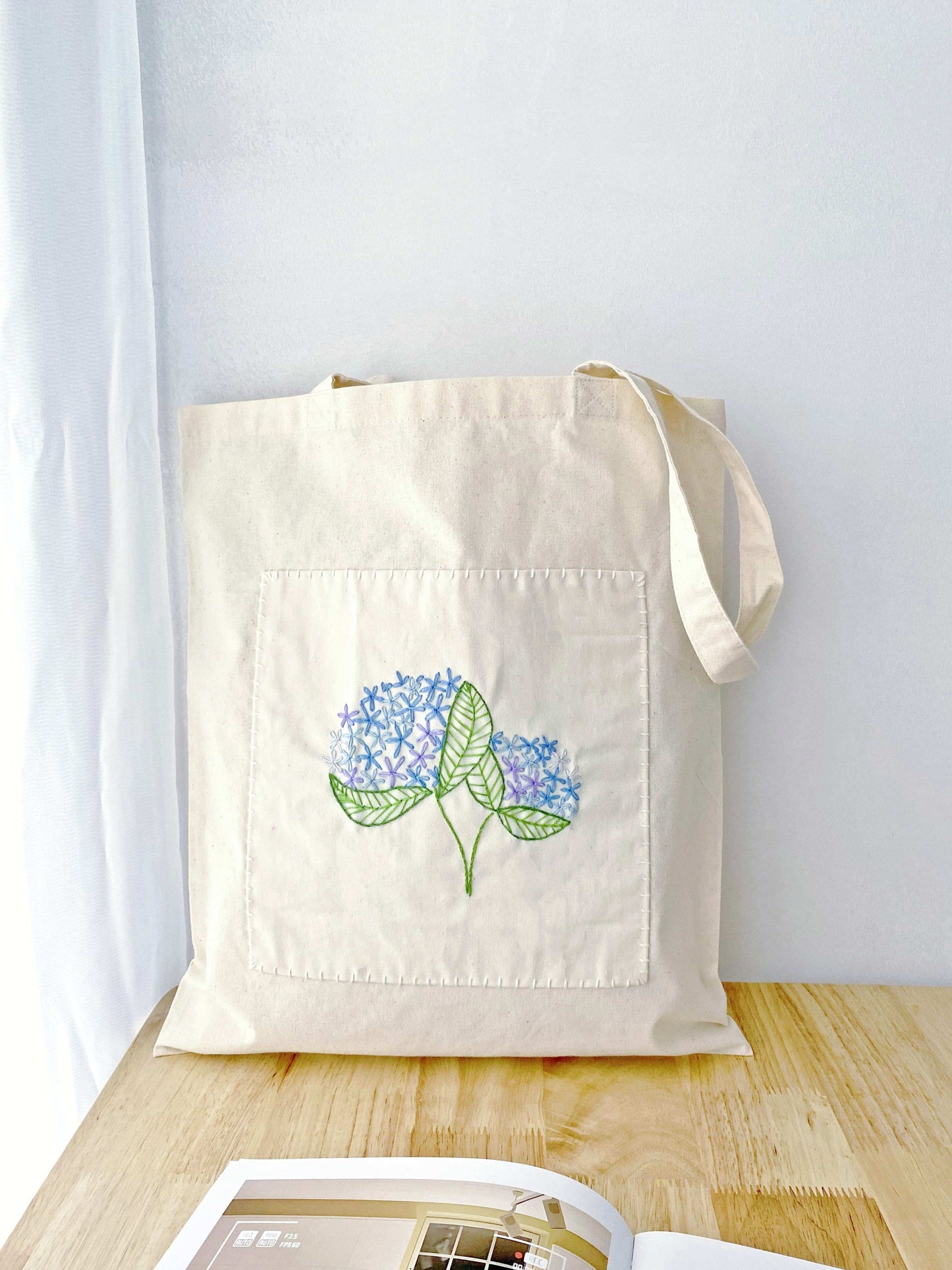 natural material tote bag with unique hand embroidered art