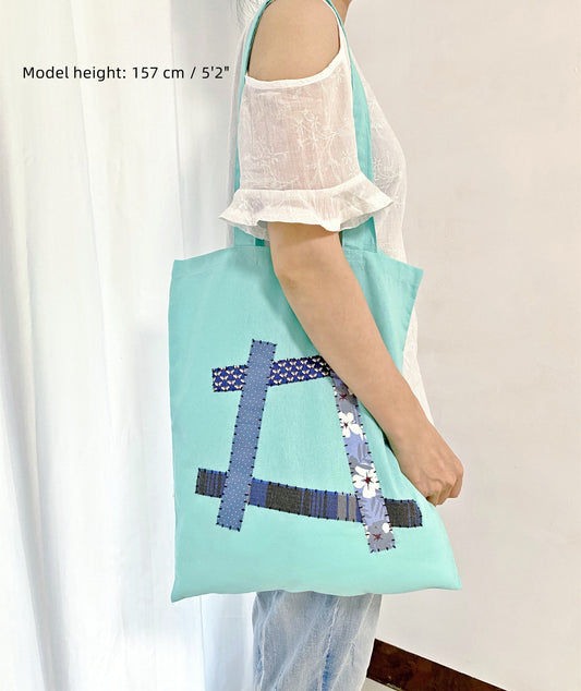 Eco-friendly shoulder bag with unique hand-stitched patchwork design