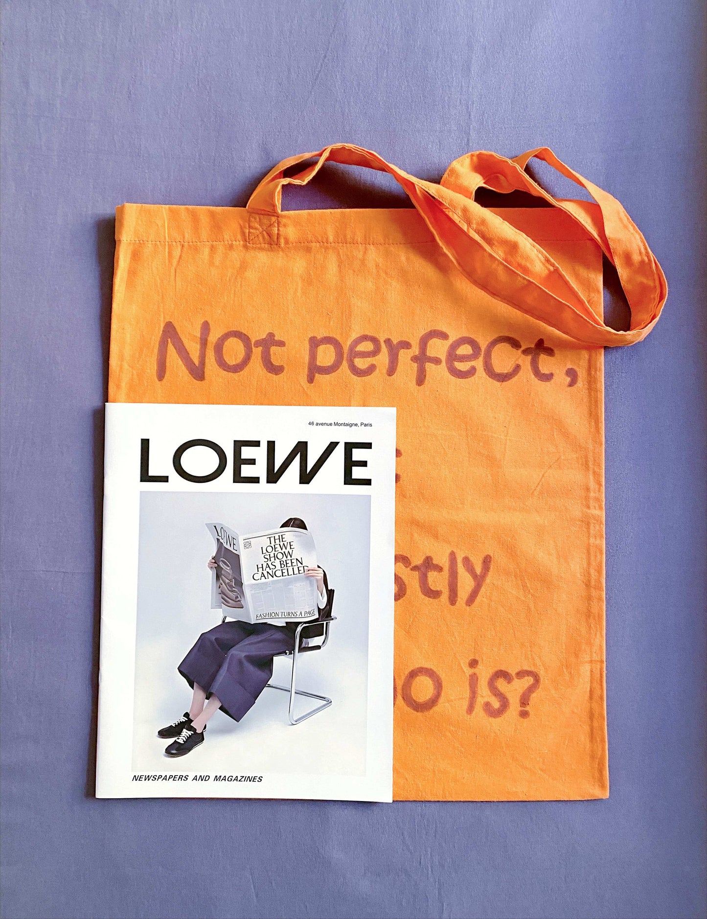 soft fabric shoulder bag with a minimal English text accent