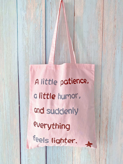 Ultra-light fabric tote with a casual handwritten phrase, designed for easy everyday carry