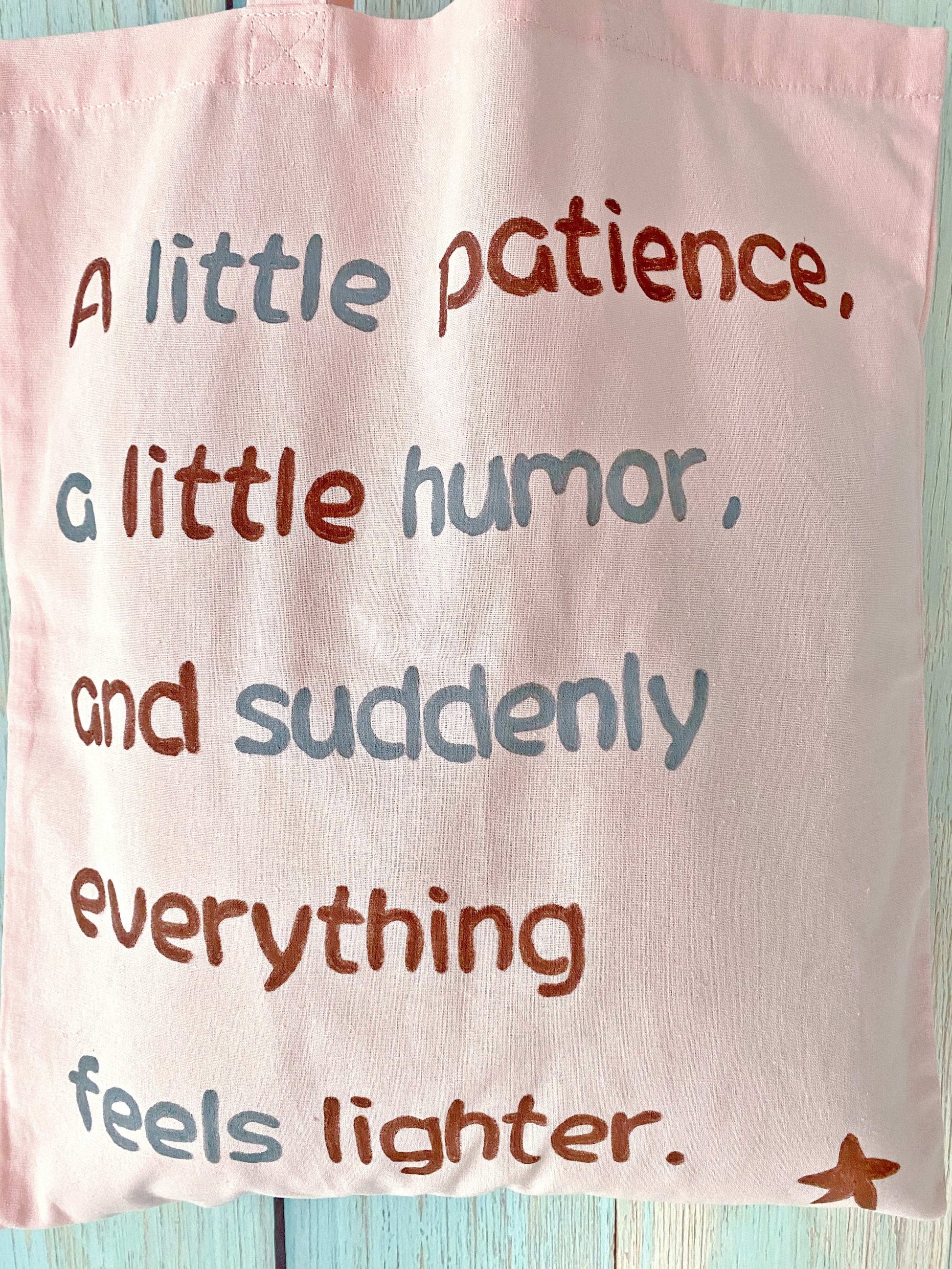 Gentle pink fabric tote with breathable natural fibers and a simple handwritten detail