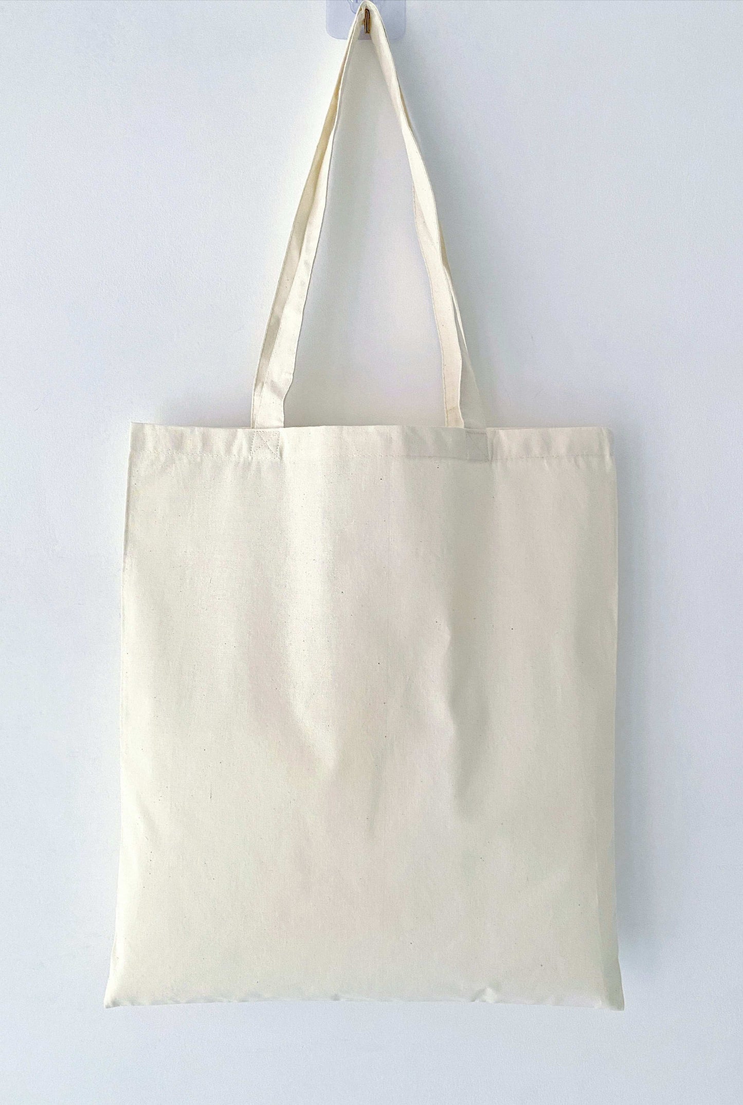 Relaxed-fit cotton tote ideal for books, laptops, or groceries.