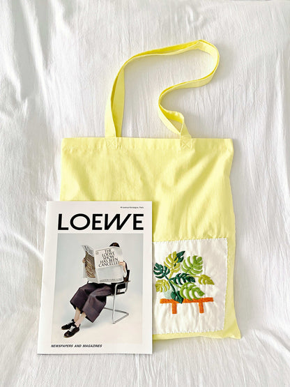 natural cotton tote with elegant stitched flowers