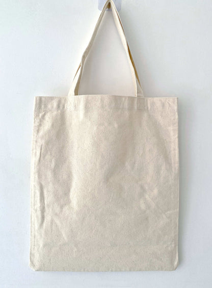 Eco-conscious cotton shoulder bag with handcrafted embroidery design