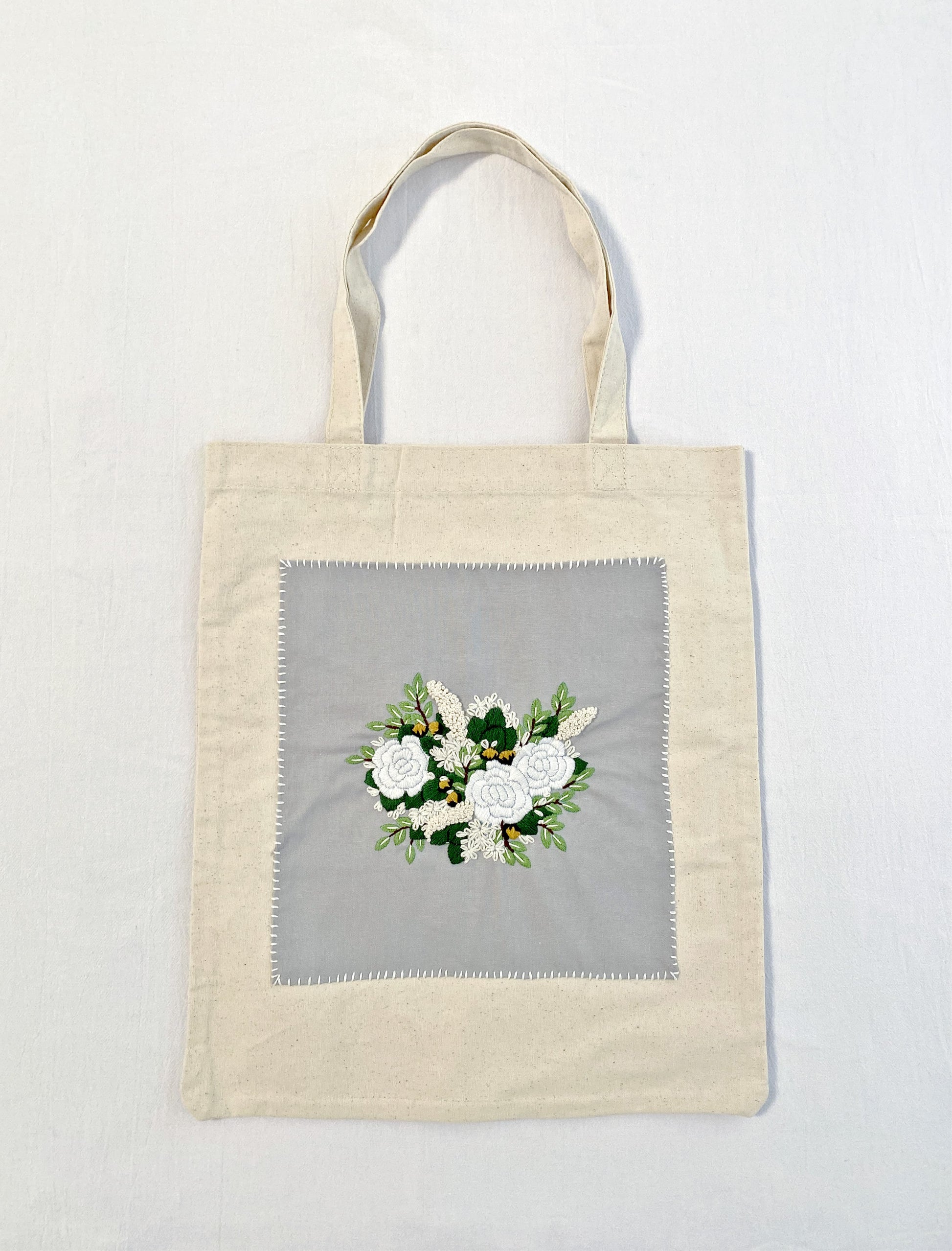 Minimalist cotton shoulder bag with unique floral embroidery
