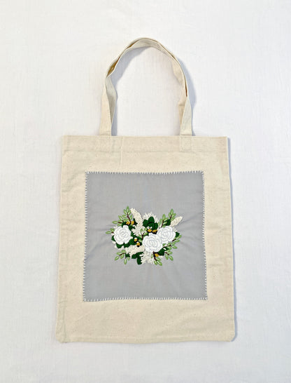 Minimalist cotton shoulder bag with unique floral embroidery