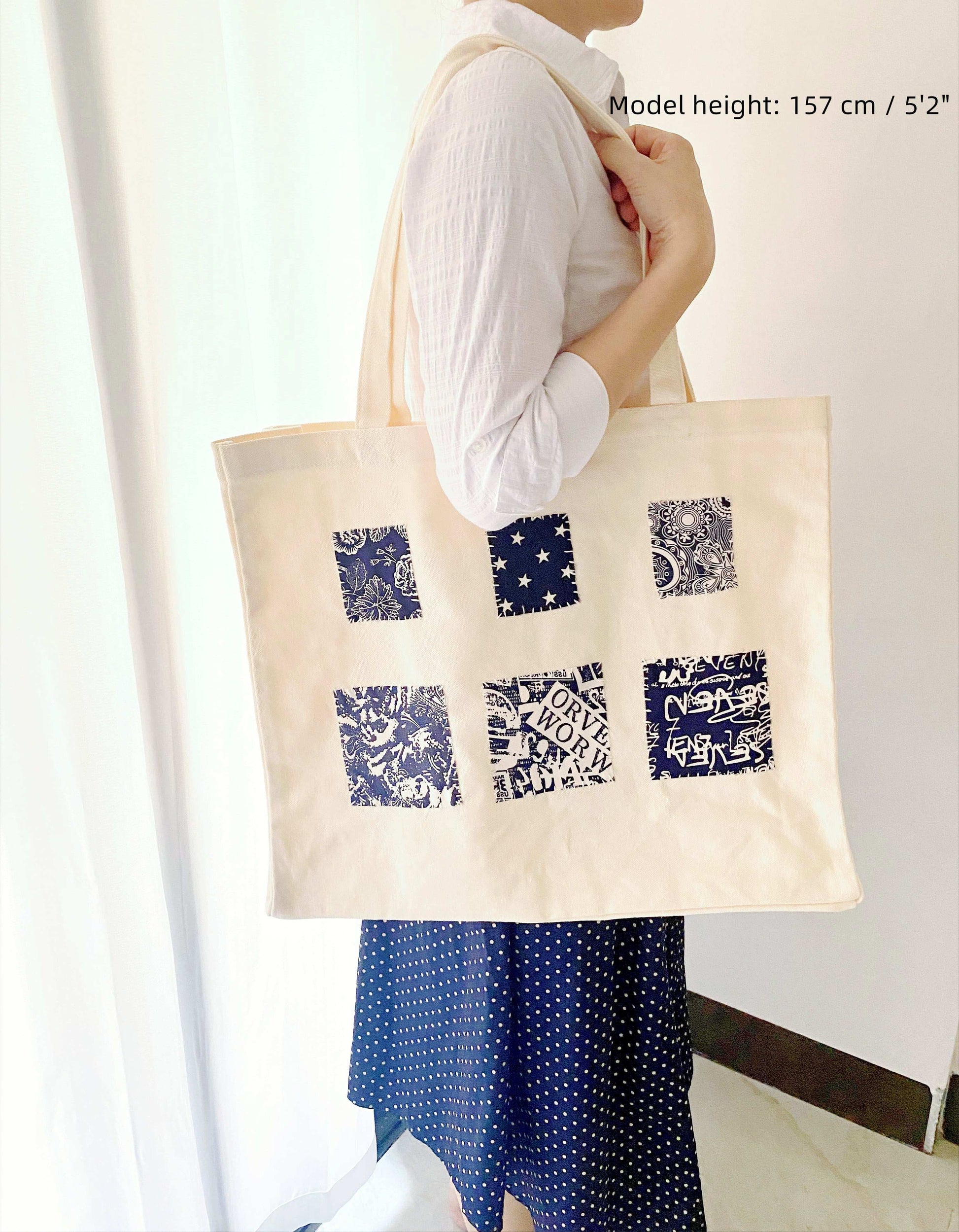 Eco-friendly shoulder bag in simple design, featuring large capacity and sustainable materials with artisanal sewn patterns