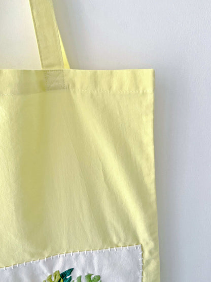 handmade embroidery tote bag symbolizing green and mindful living