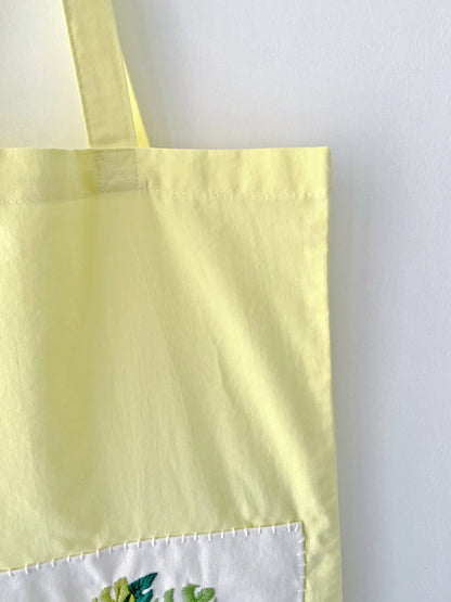 handmade embroidery tote bag symbolizing green and mindful living