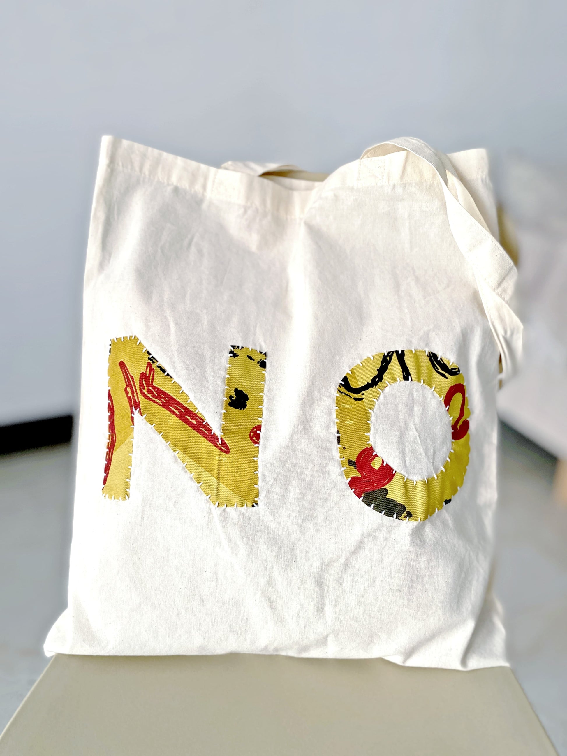 Lightweight eco tote bag with artisanal hand-sewn patchwork for daily essentials