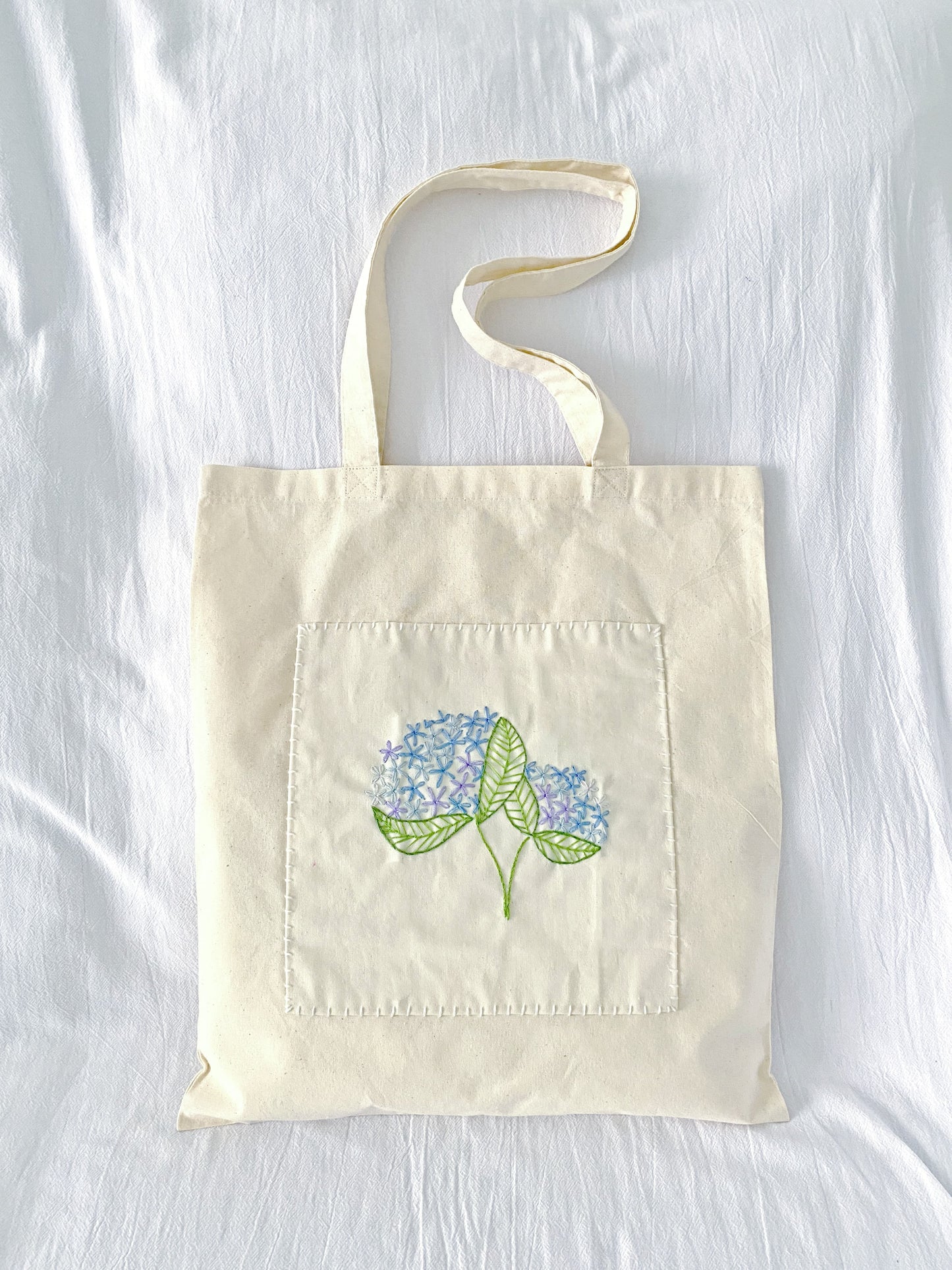 sustainable natural cotton tote featuring soft handmade embroidery