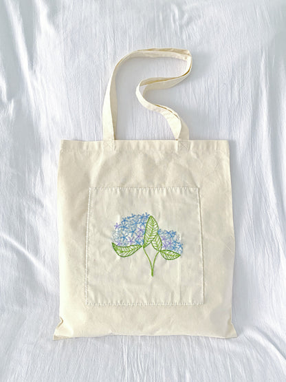 sustainable natural cotton tote featuring soft handmade embroidery