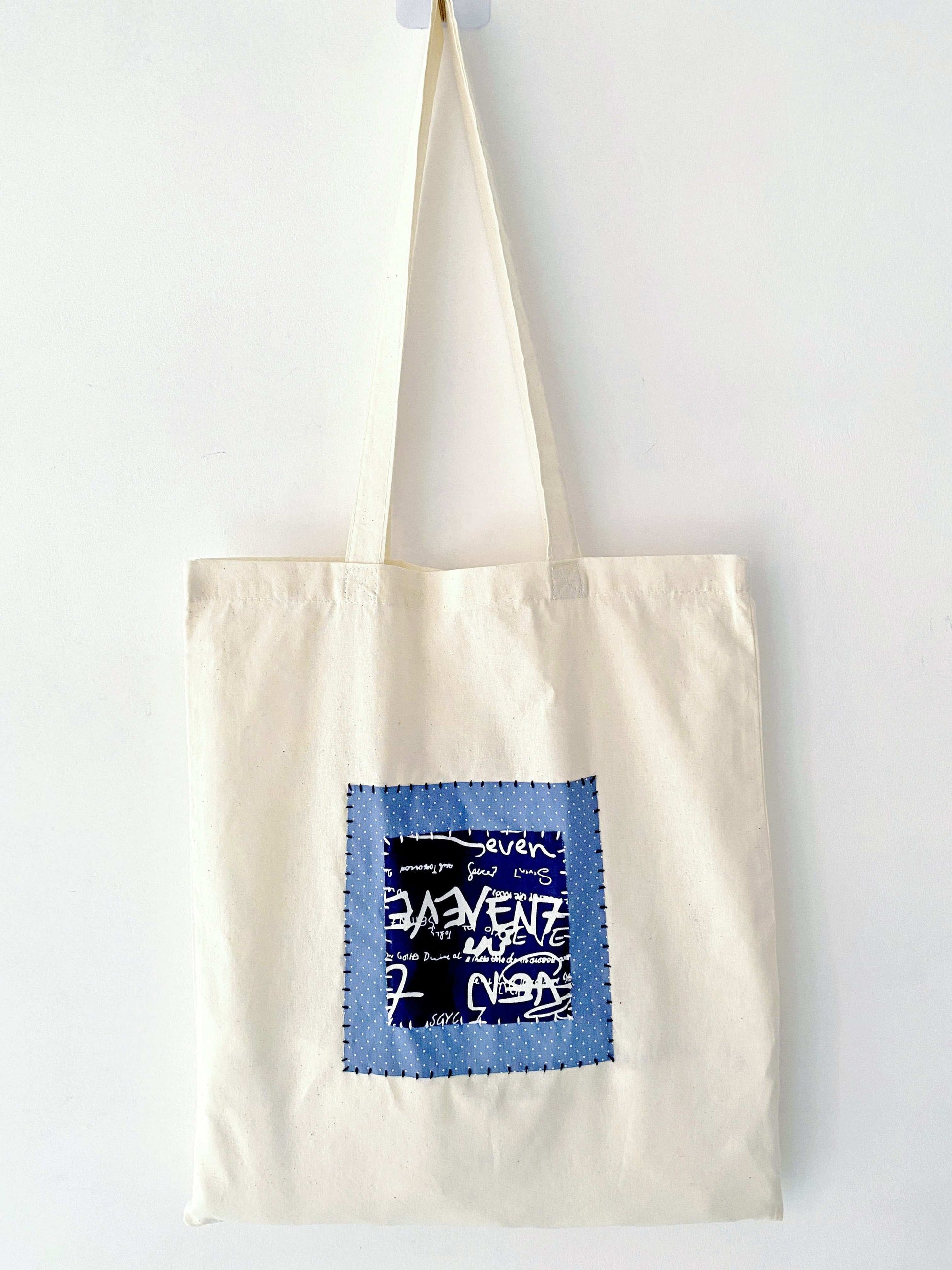 Spacious bag featuring hand-sewn patchwork, blending durability and relaxed elegance