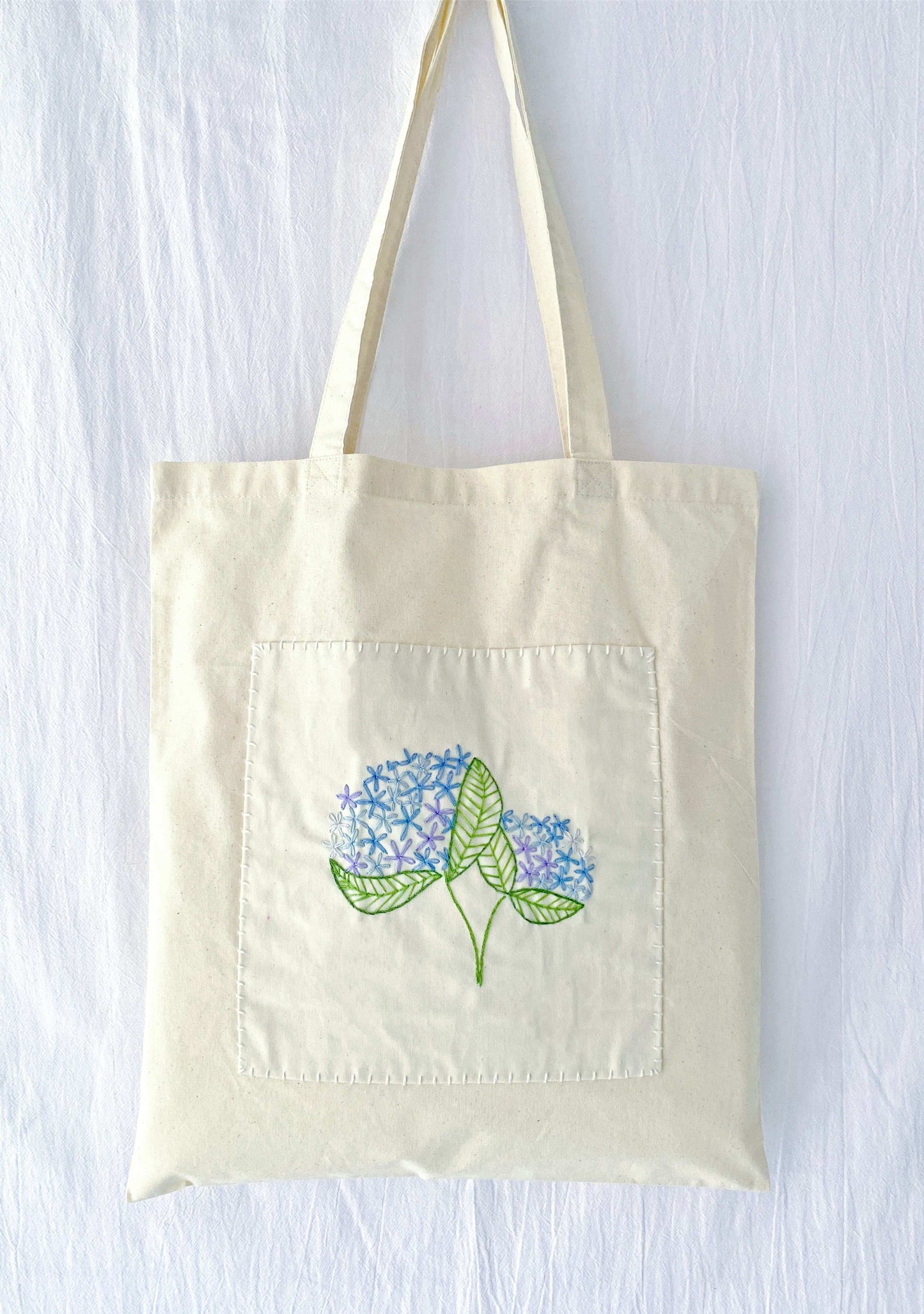 sustainable fabric bag with hand embroidered minimalist design