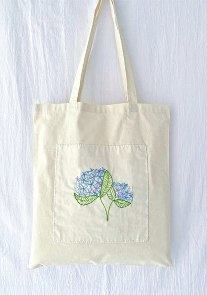 sustainable fabric bag with hand embroidered minimalist design