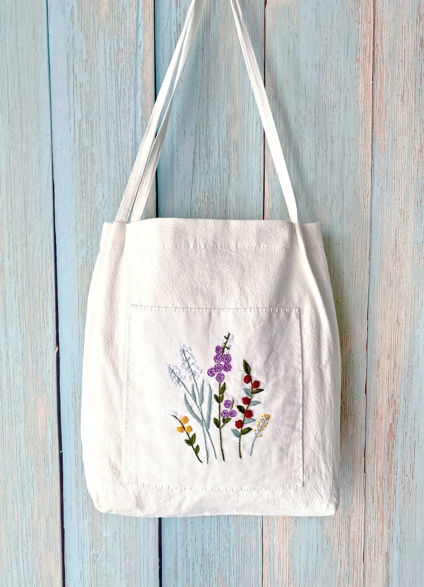 artistic embroidered linen shoulder bag as a thoughtful eco-friendly gift
