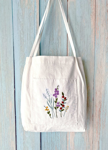 artistic embroidered linen shoulder bag as a thoughtful eco-friendly gift