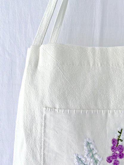 minimalistic linen tote with delicate flower stitching