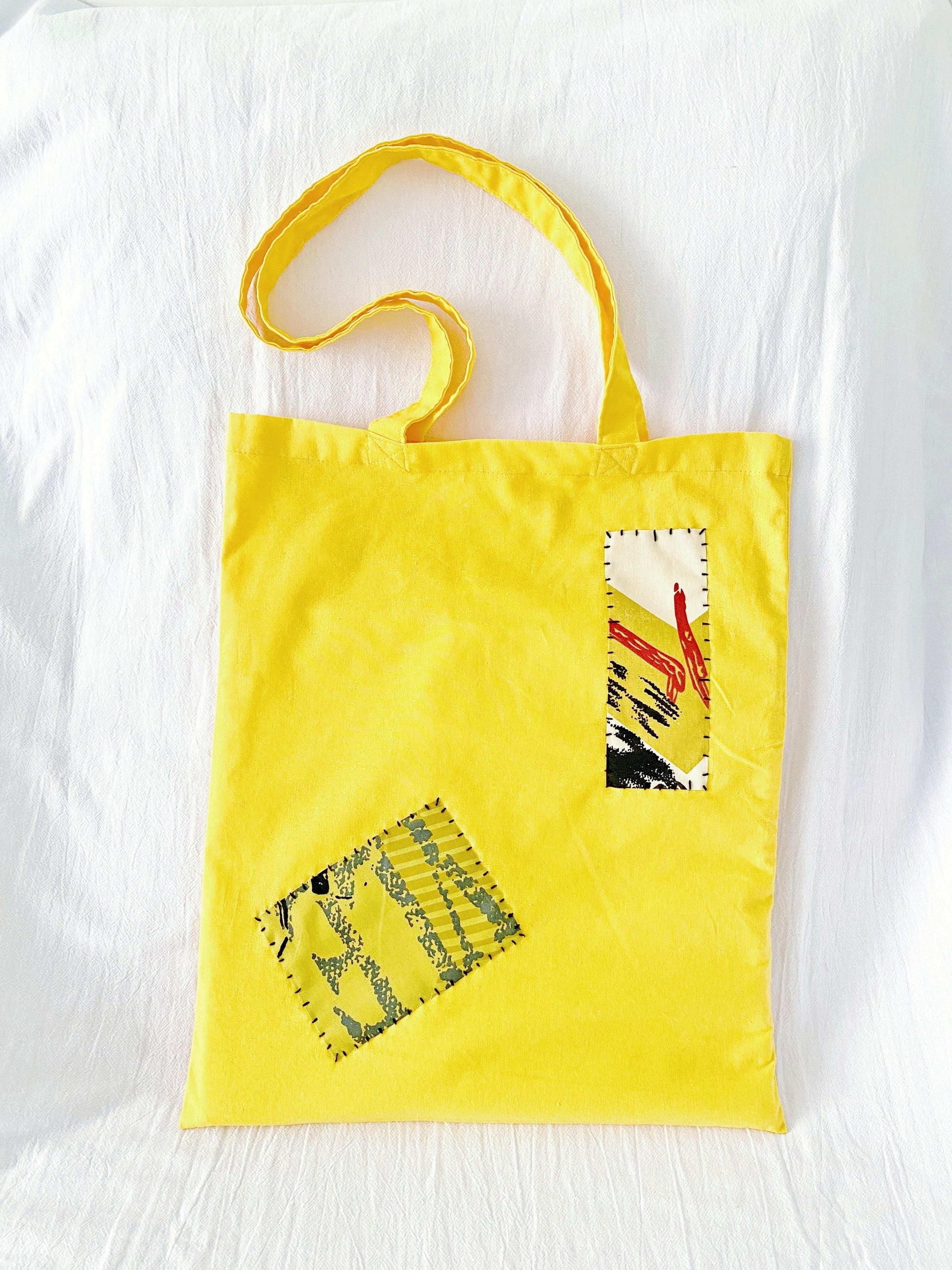 Eco tote with artistic flair from sewn patchwork, designed for comfort and capacity