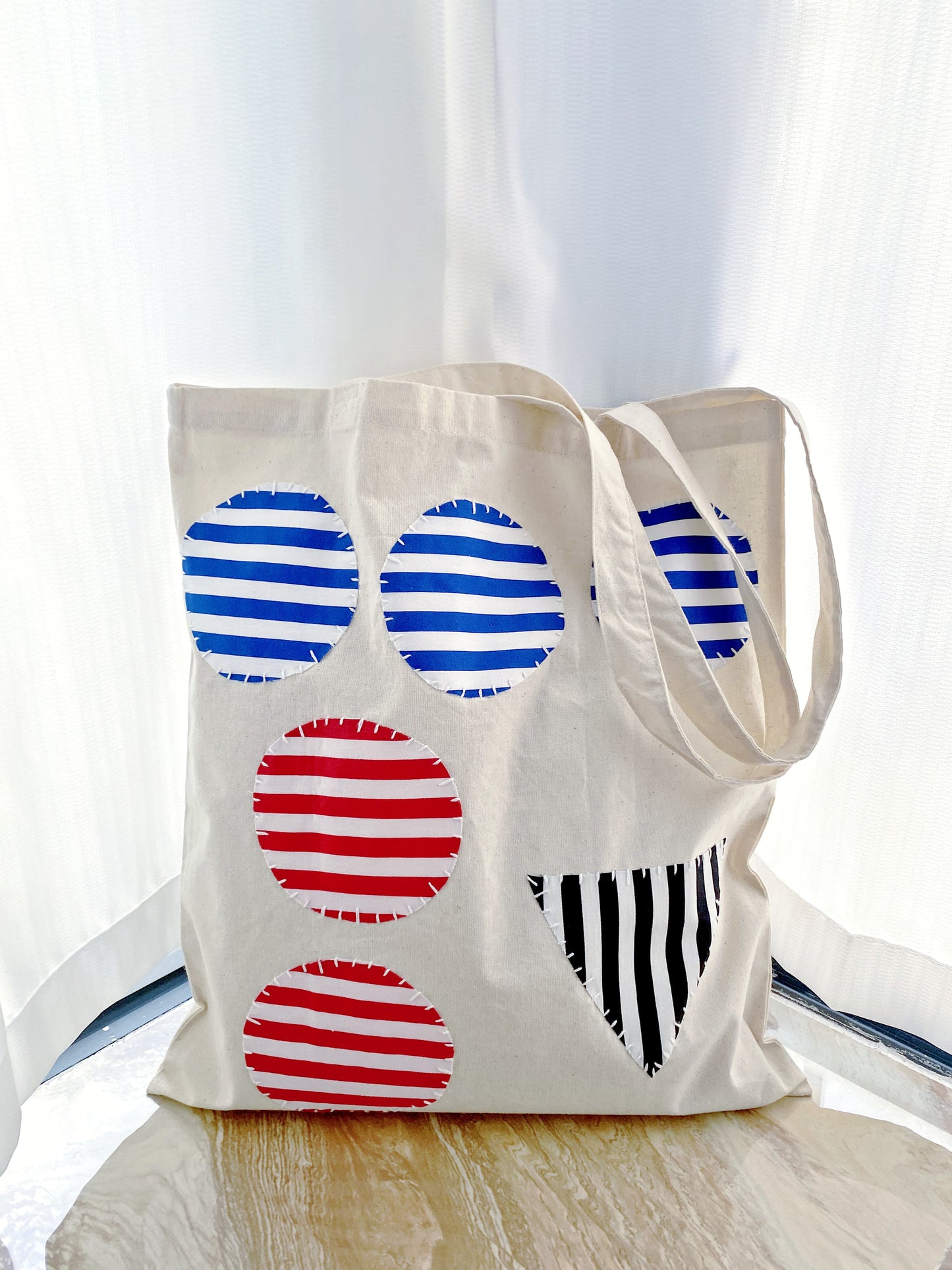 Stylish casual tote bag with creative stitched patterns and long handles