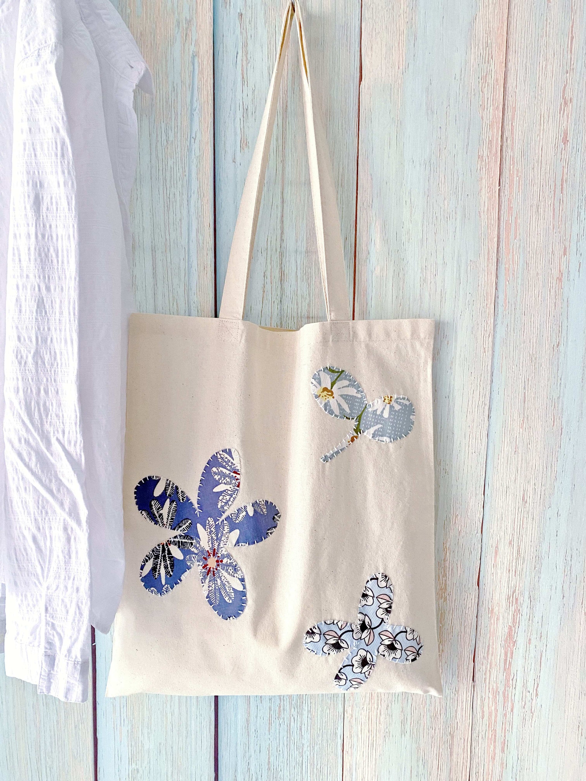 modern canvas bag with hand-stitched applique for relaxed style