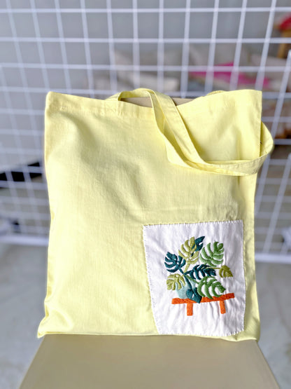 Yellow cotton tote bag with handmade plant embroidery for women
