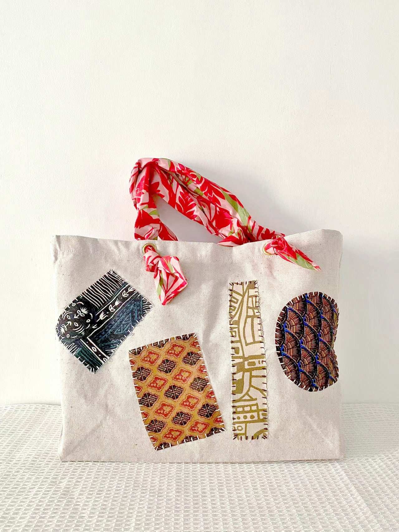 Eco-friendly large capacity tote with minimalist design and artisanal patchwork details for versatile fashion